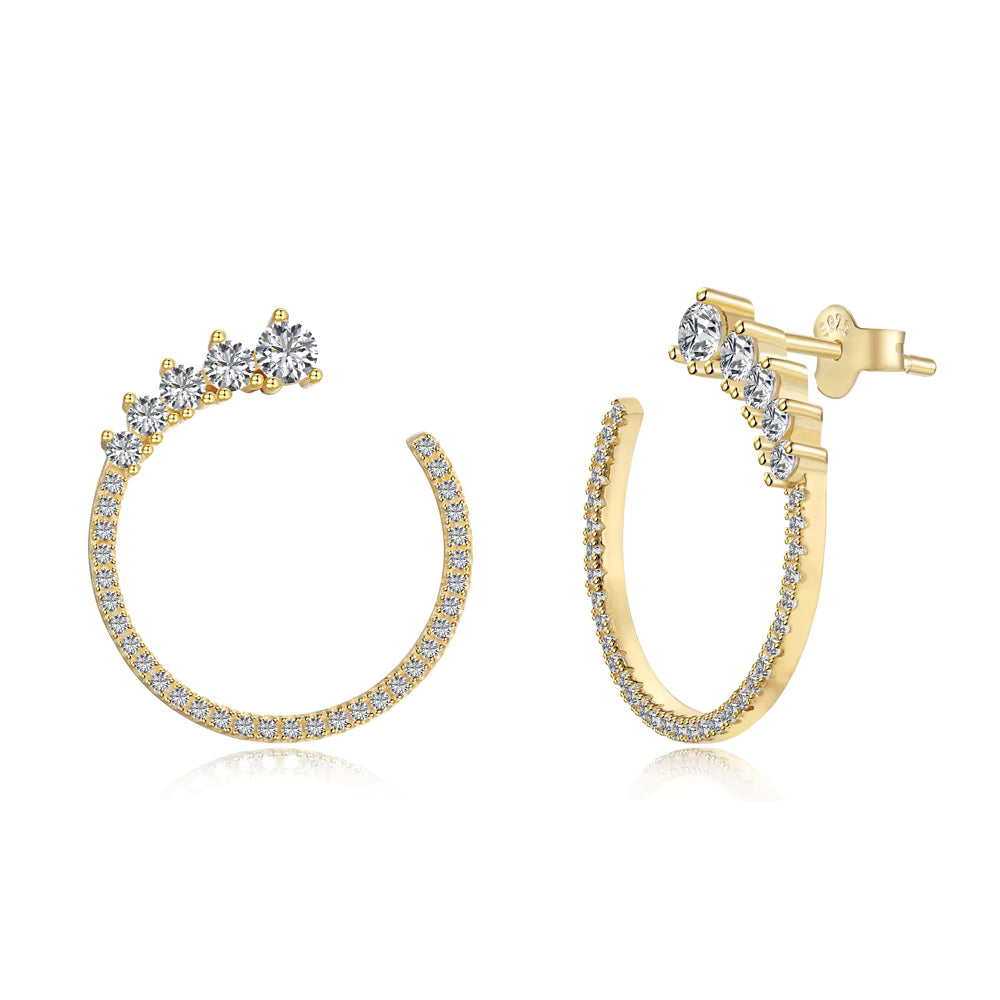 Gold hoop earrings with clear gemstones on a white background